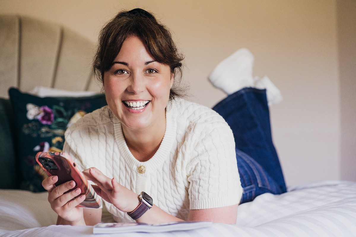 Aniko Rucz working on short-term rental systems, sharing real-world hosting knowledge from hands-on experience