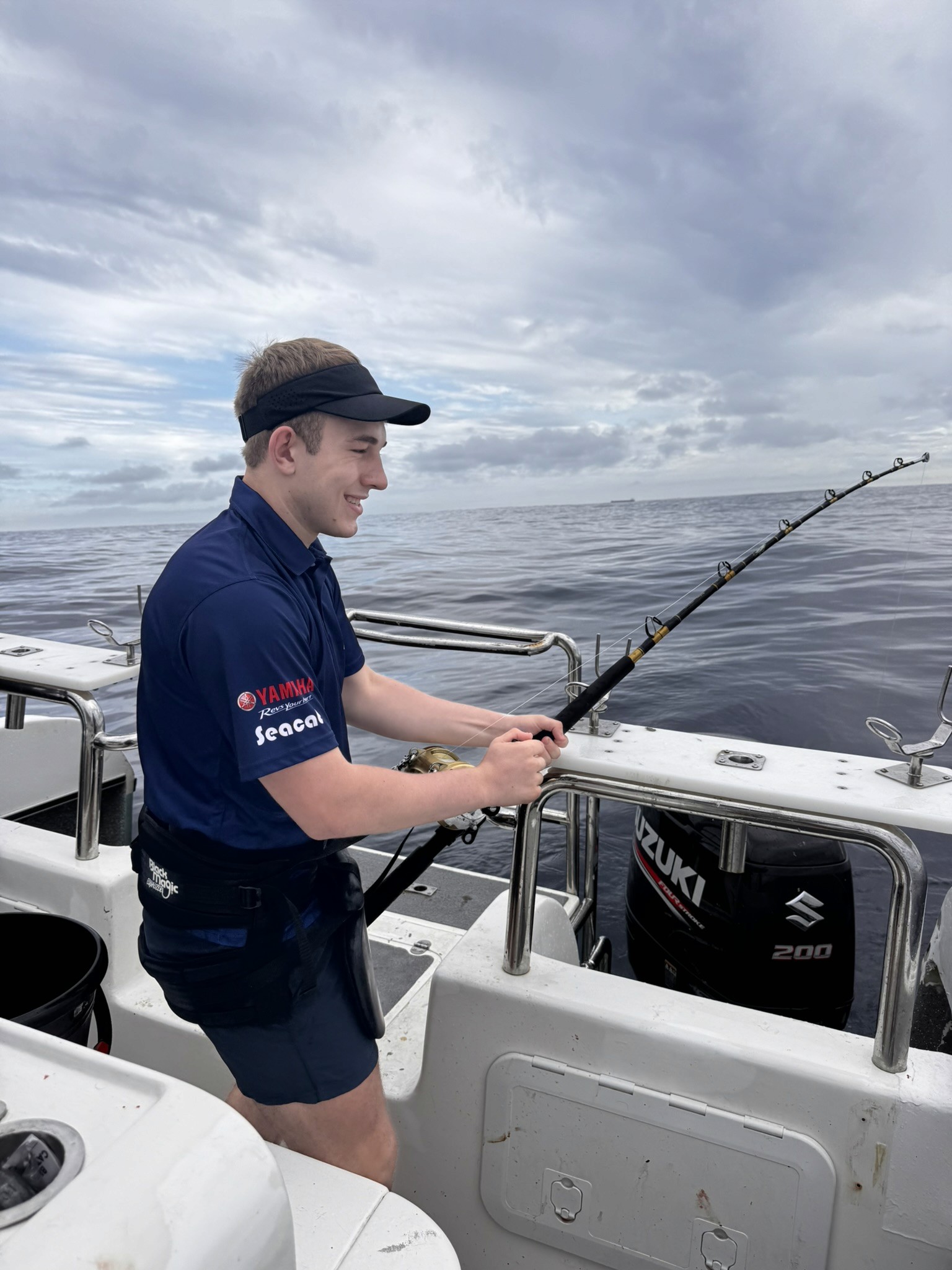 Fishermen celebrating a successful catch on a Salt Safari charter.