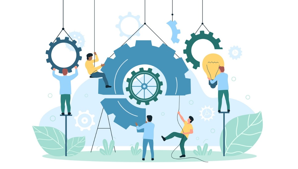 A team assembling large gears and holding a light bulb—symbolizing the collaborative effort, innovation, and strategic thinking central to concept development.