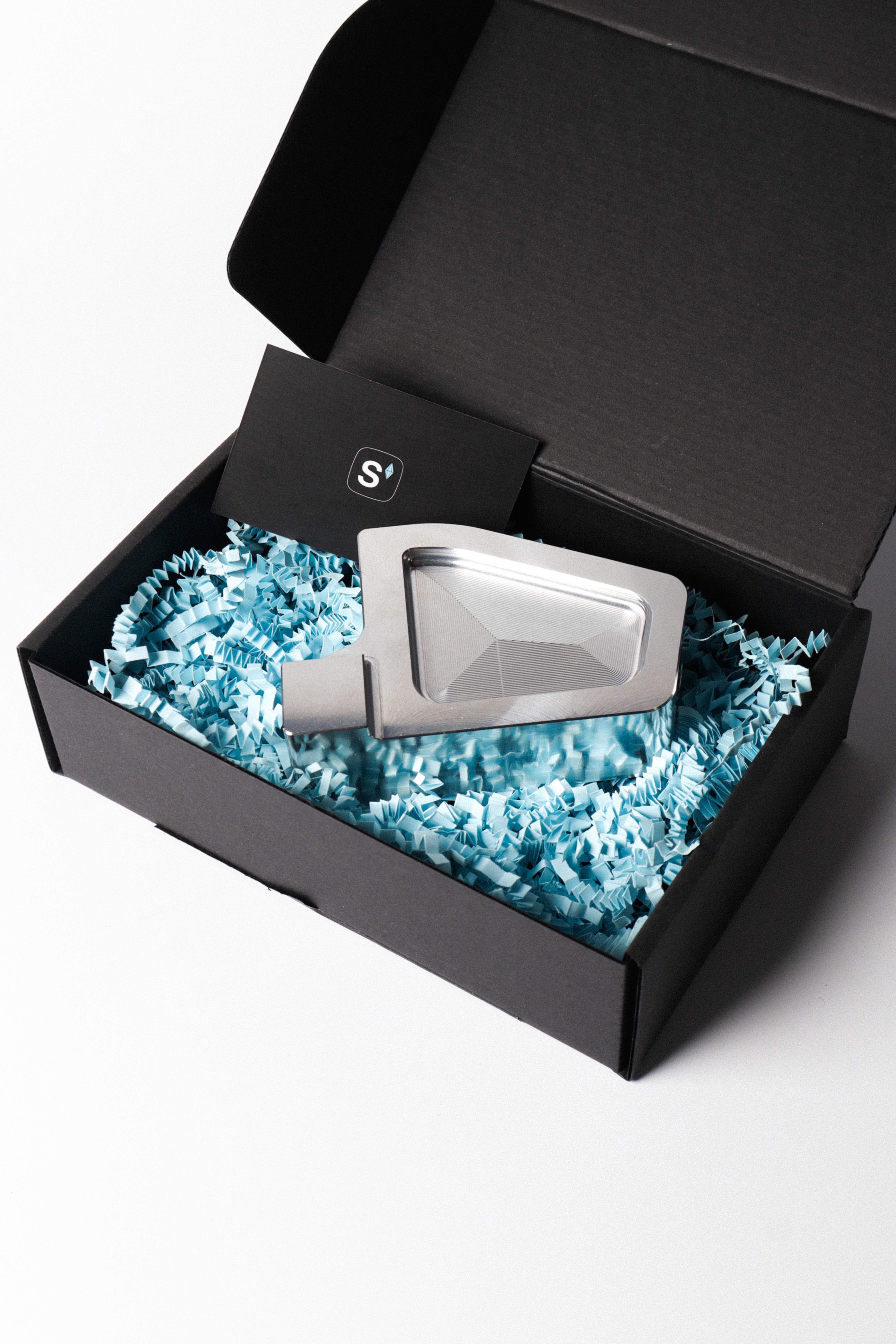 Engine mount in its packaging with a thank you card