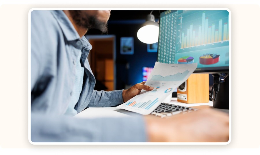 Person analyzing reports and charts