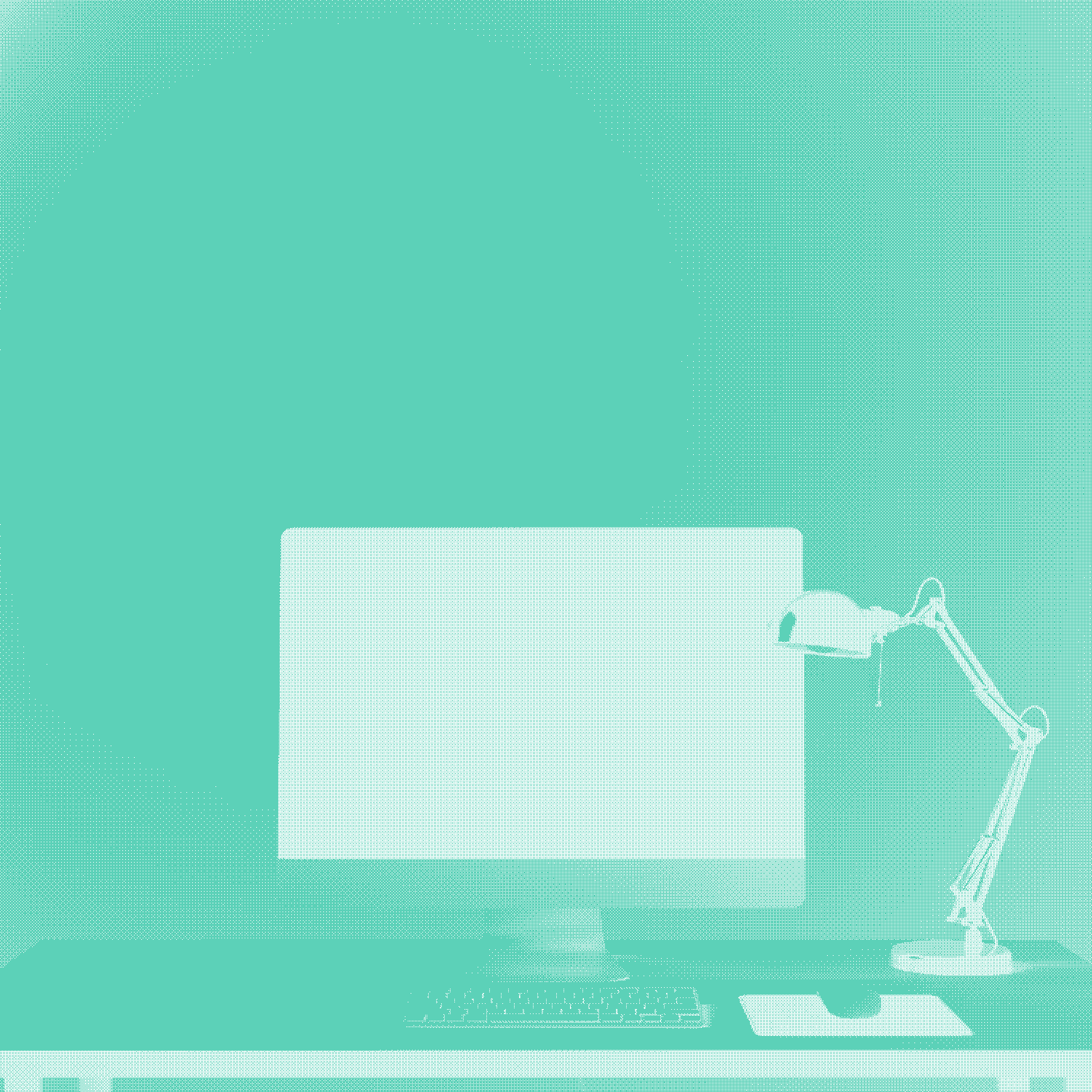 A desk setup with adesk lamp on the side