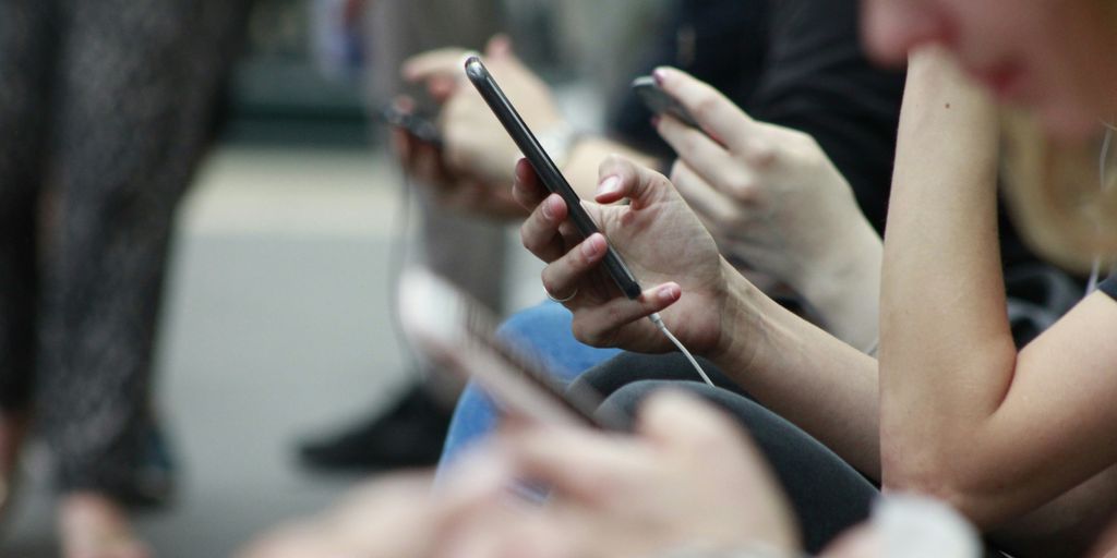 person holding black phone