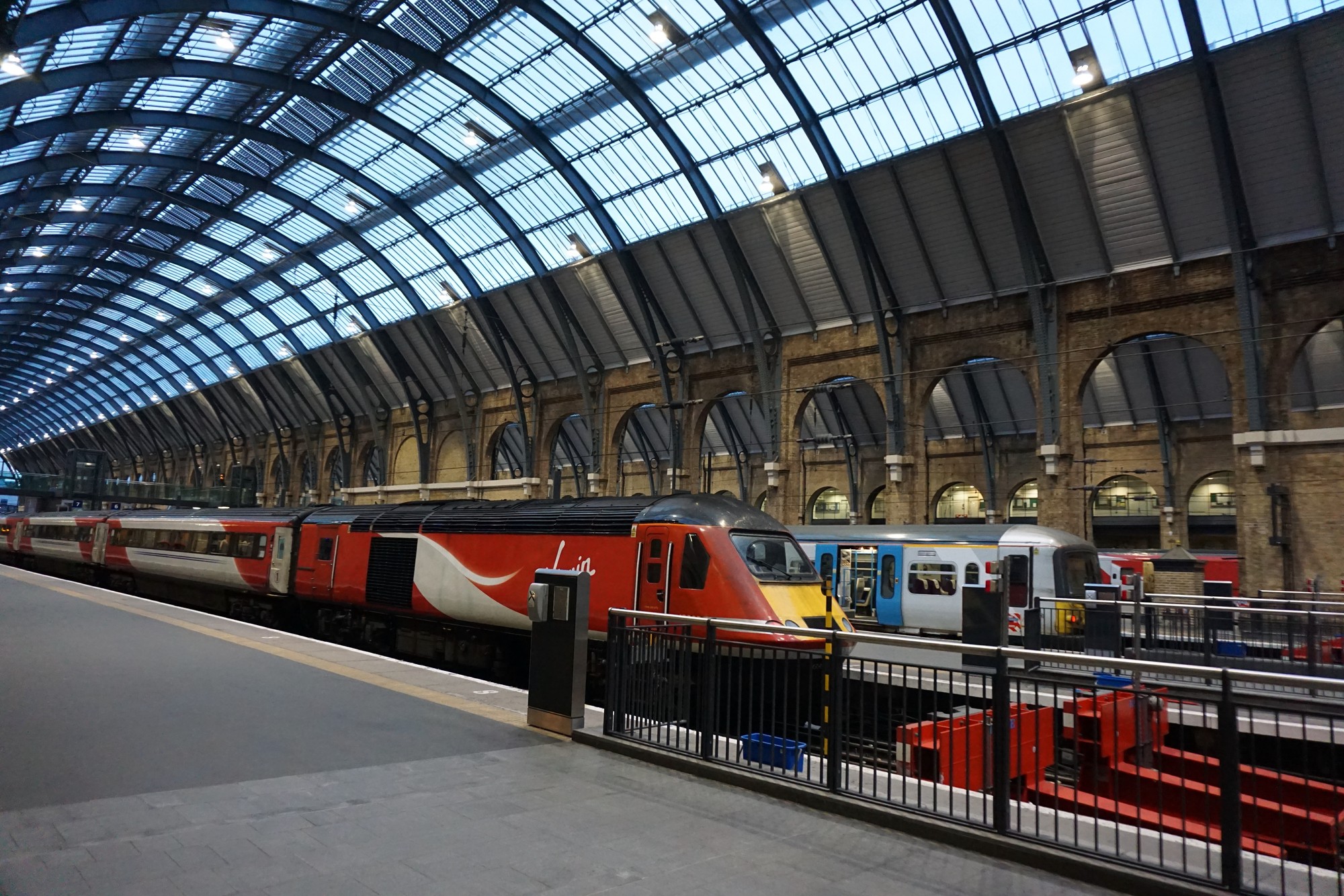 brown wooden beach lounge chair on beach during daytime