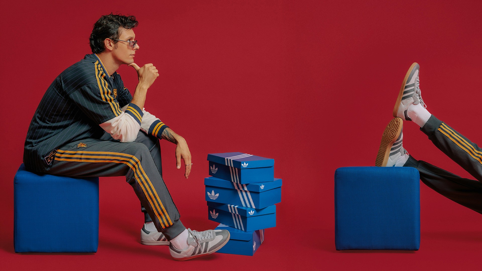 Streetside billboard with flyposters of the Batch.Works brand and illustrations