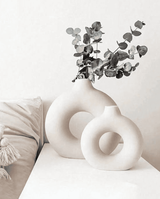 a woman sitting on a couch talking to another woman