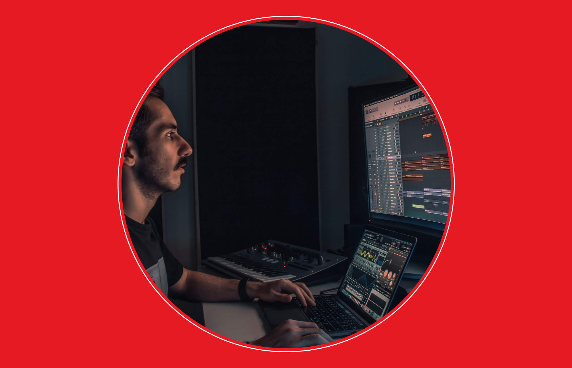 Mixing engineering working on a laptop and desktop