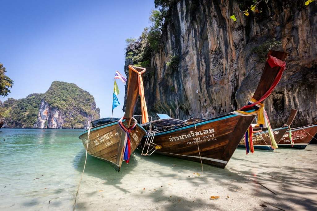 long boats on the beach in railay, thailand