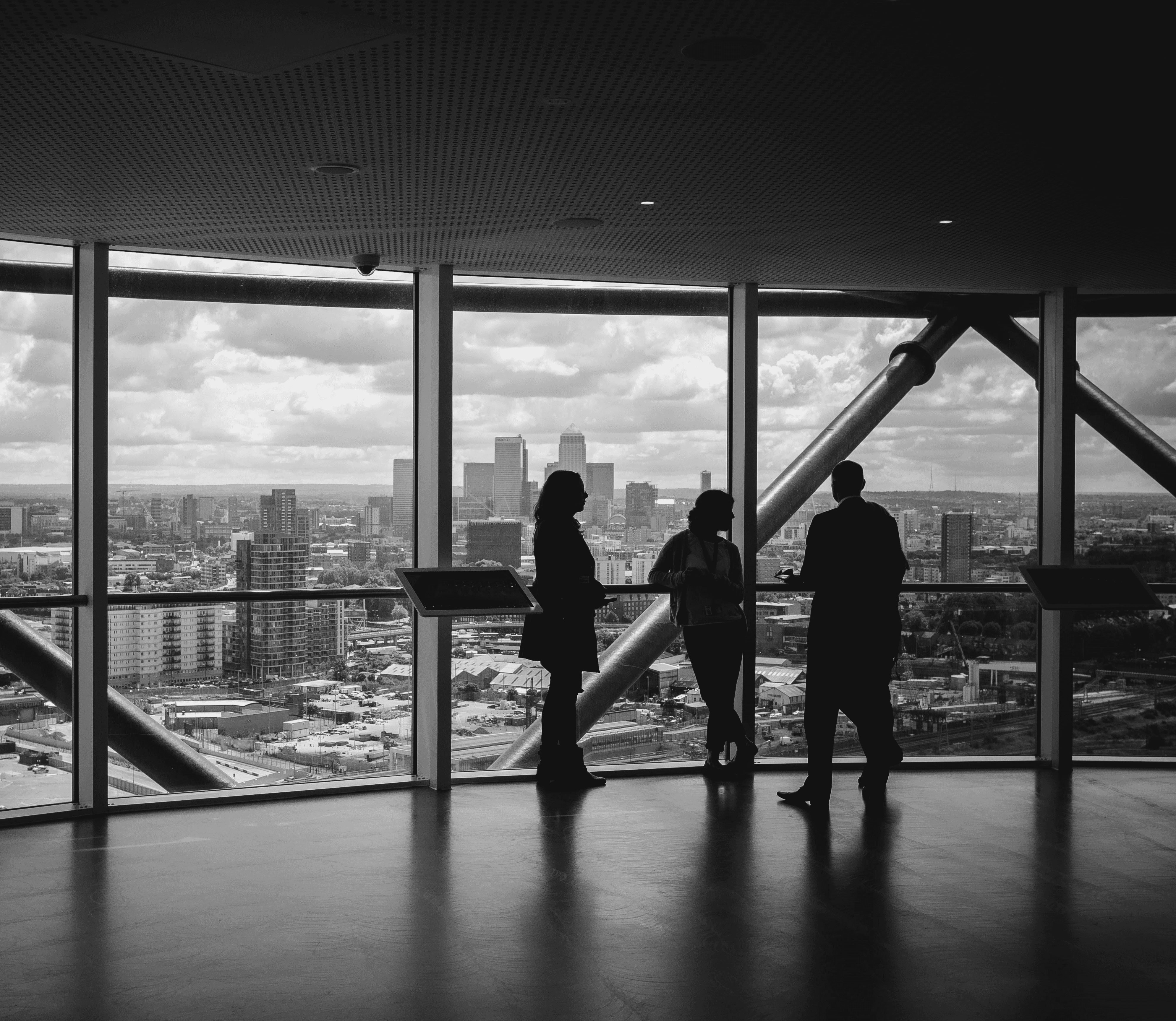 people standing inside city building