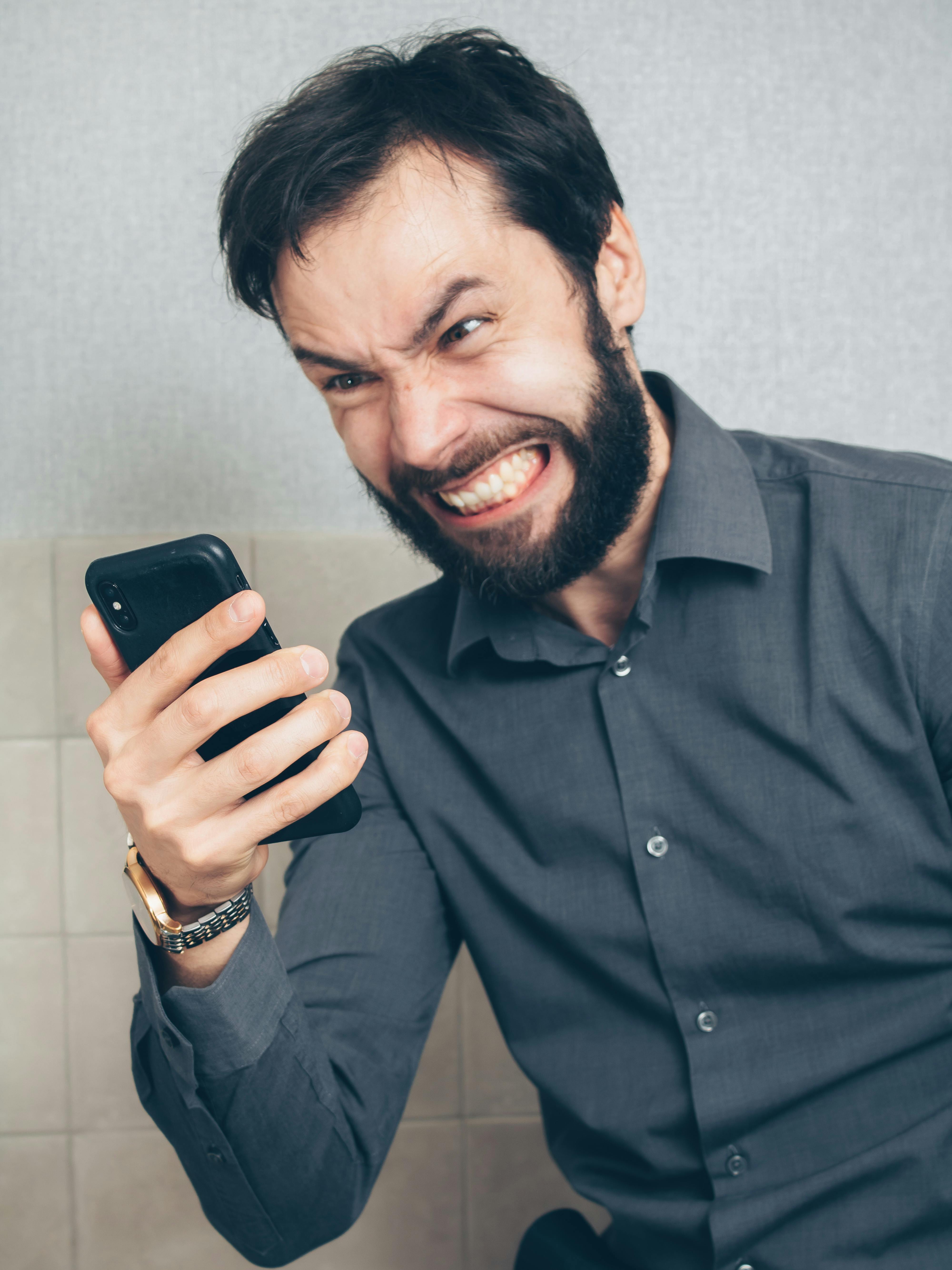 Smiling business owner using smartphone to manage cleaning business operations