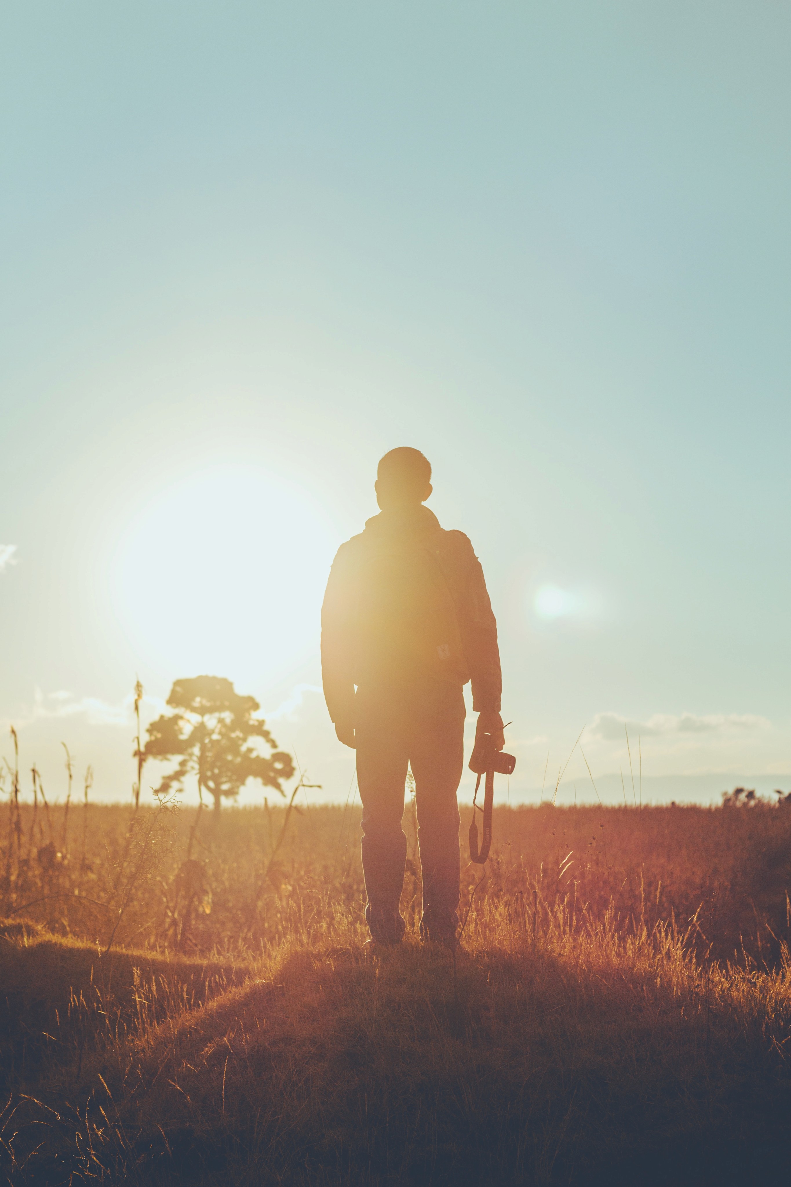 A man walking down westland in sunset