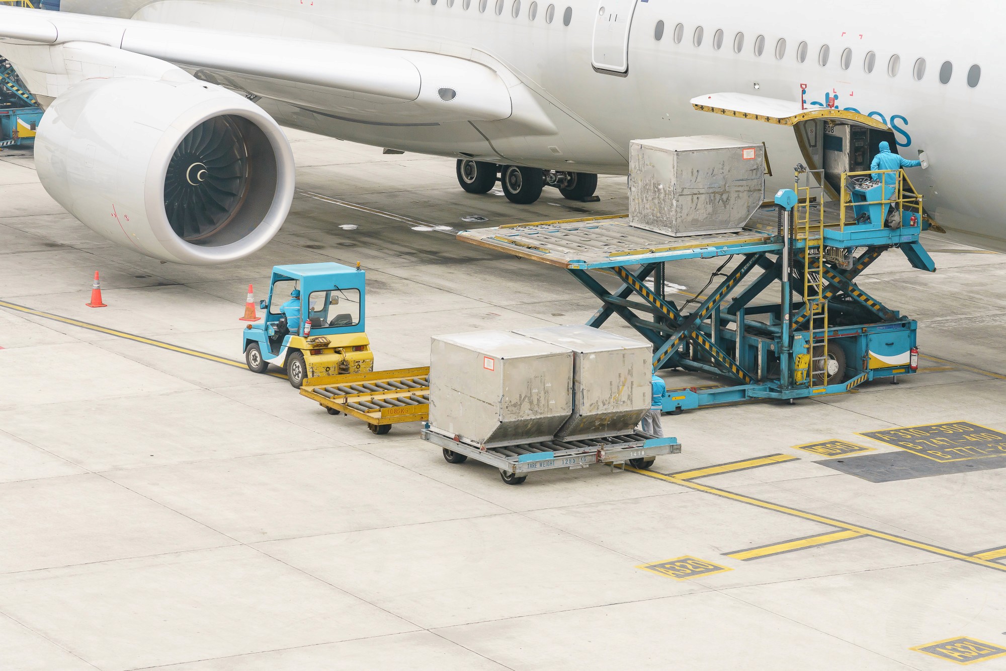A person is standing next to an airplane