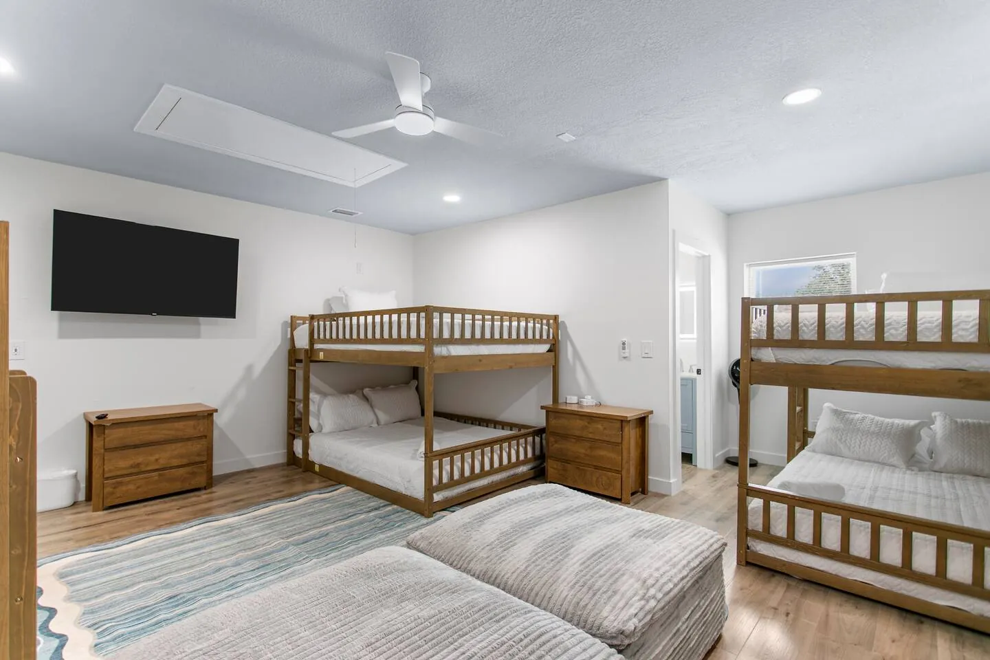 Bunk room with 2 full-over-full bunks and TV at Salty House, Bradenton, Florida