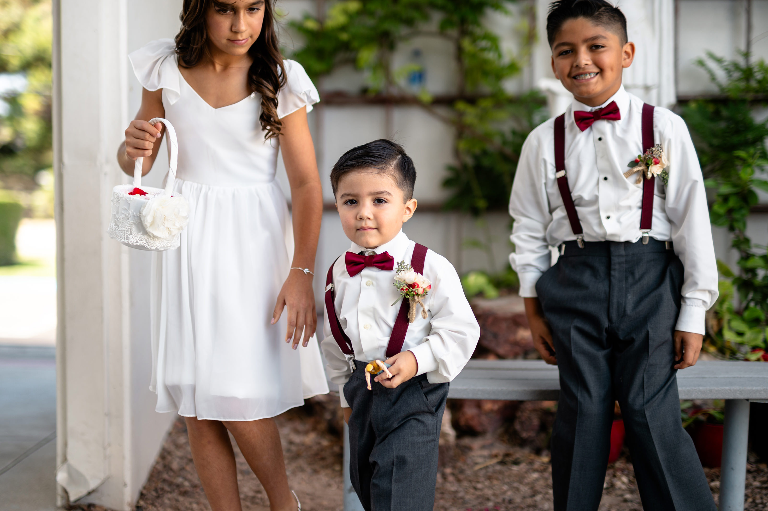 Flat lay wedding details with bouquet, rings, and sparkling bridal heels