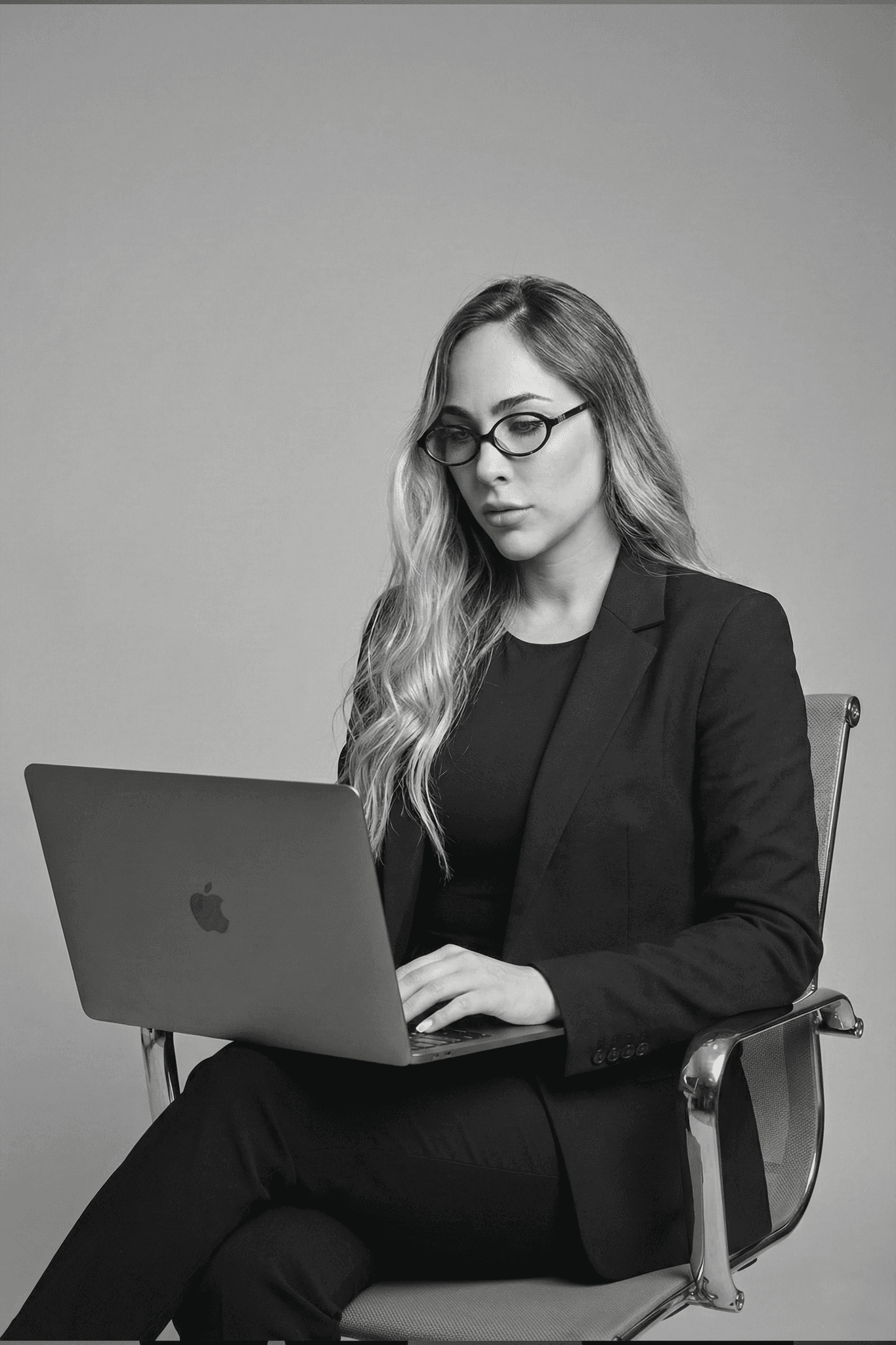 Person in a white off-shoulder top using a MacBook laptop, with text overlay 'What's new in digital?' and the fabrica® logo in the top corner.