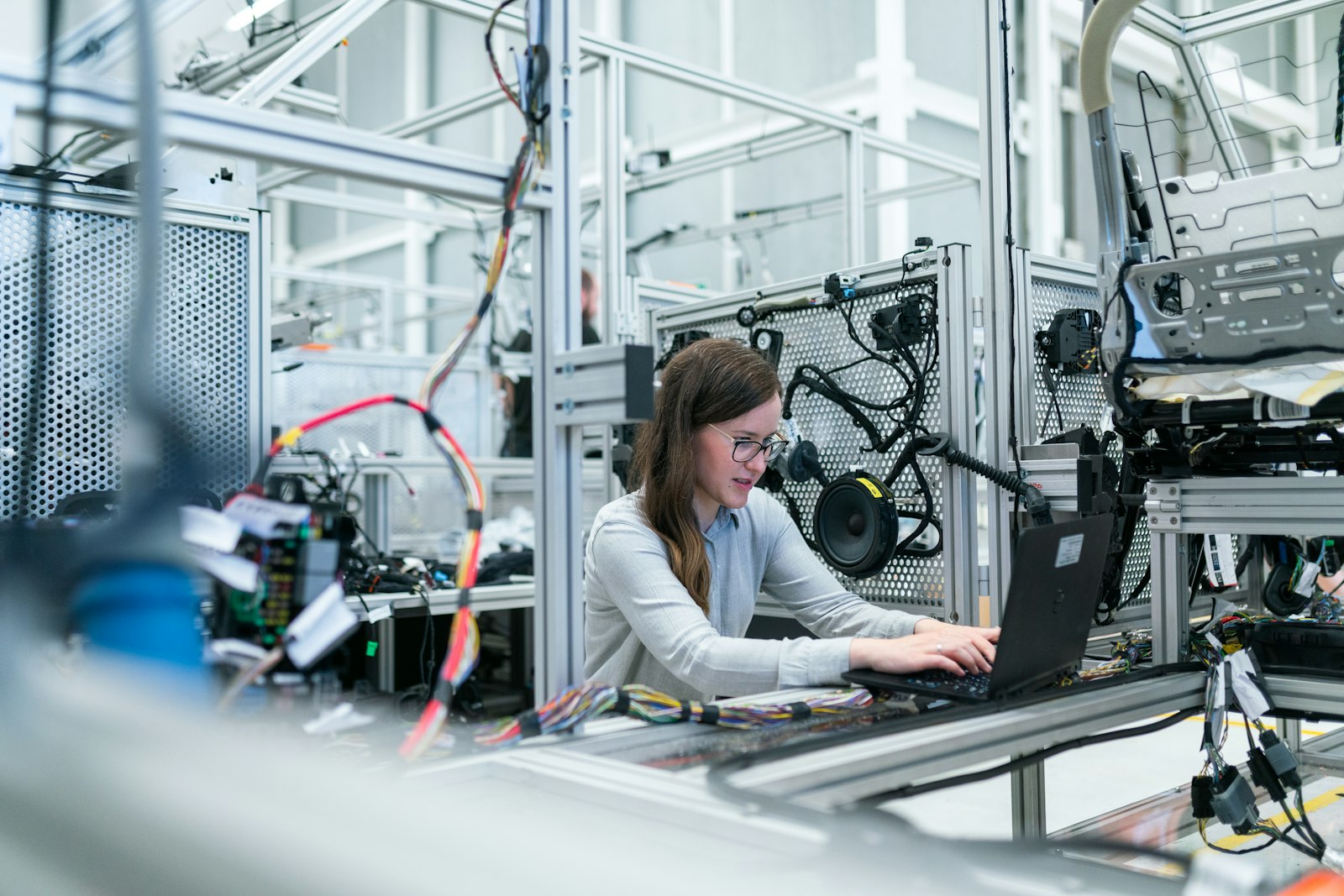 Engineer working on a laptop in an industrial facility
