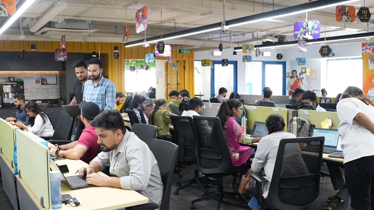 Two Men Using Laptop