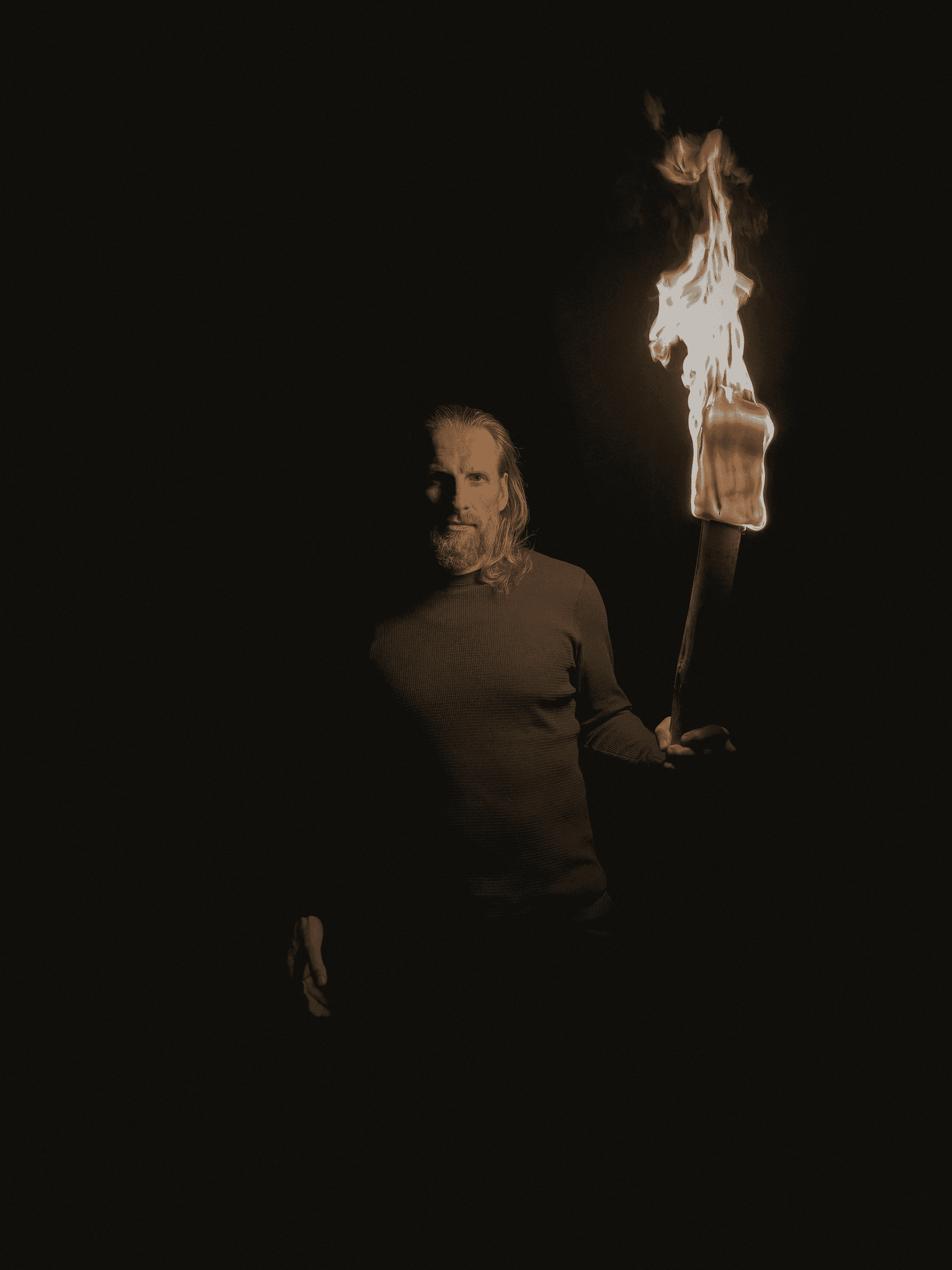 two people in a workspace working on their laptops 