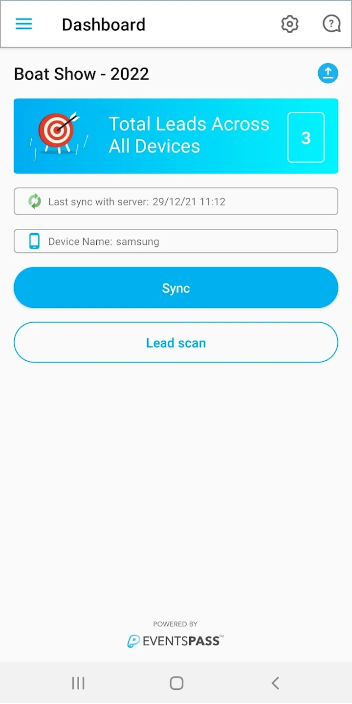 a hand holding a black device