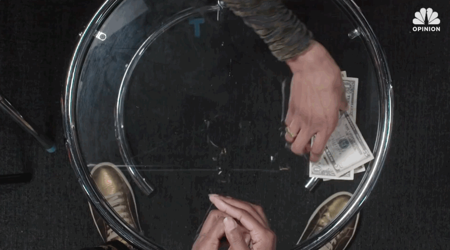 Animated title card reading '$21 Dollars with 21 Savage', seen through a glass tabletop