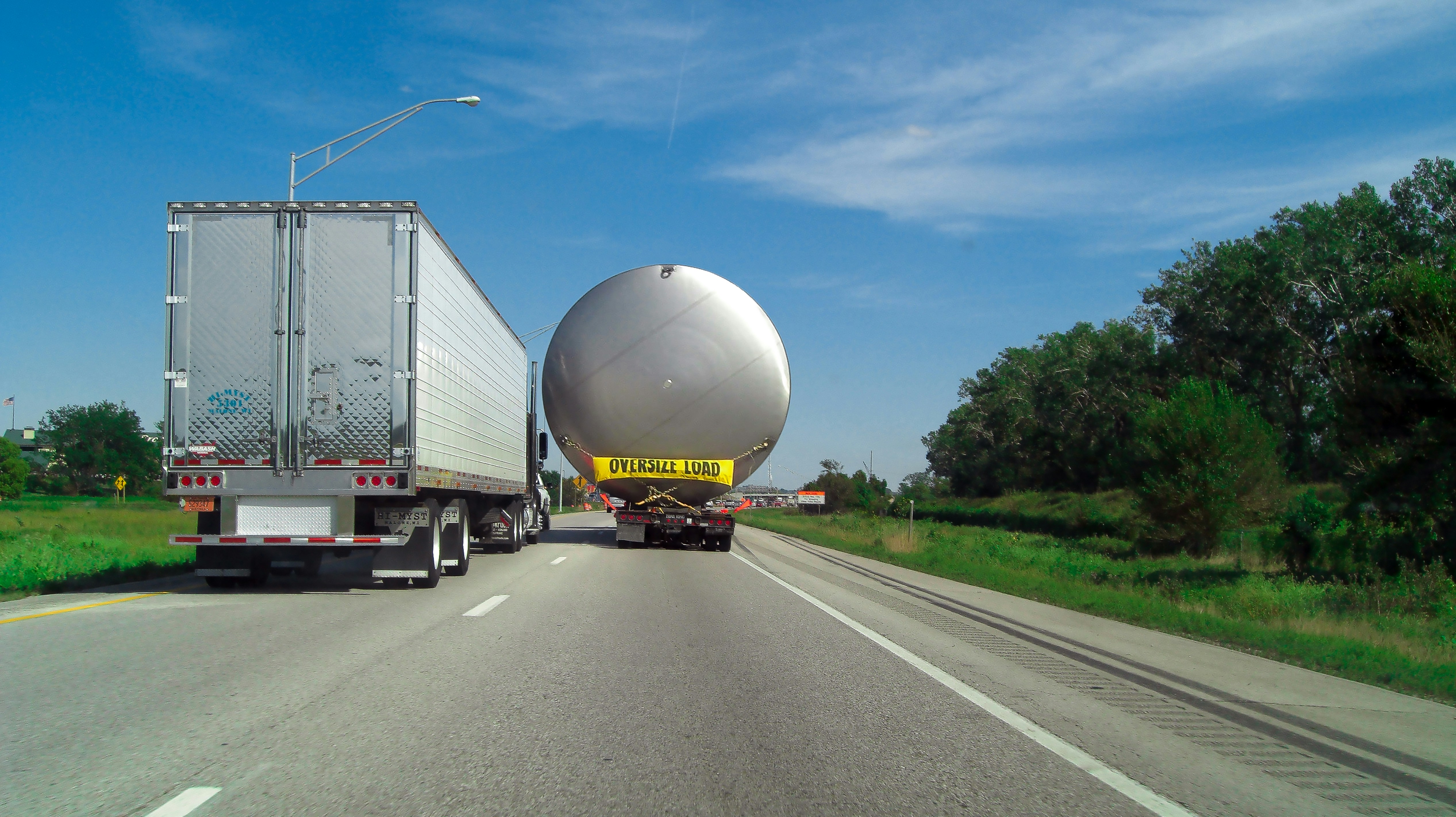 Large tanker trailer being transported on a highway