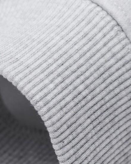 Close-up of Sunday Superior ribbed cuff on light grey hoodie
