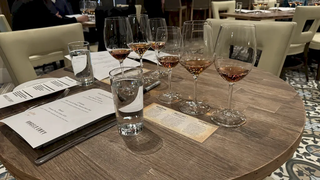 Spirits in tasting glasses setup for an educational dinner