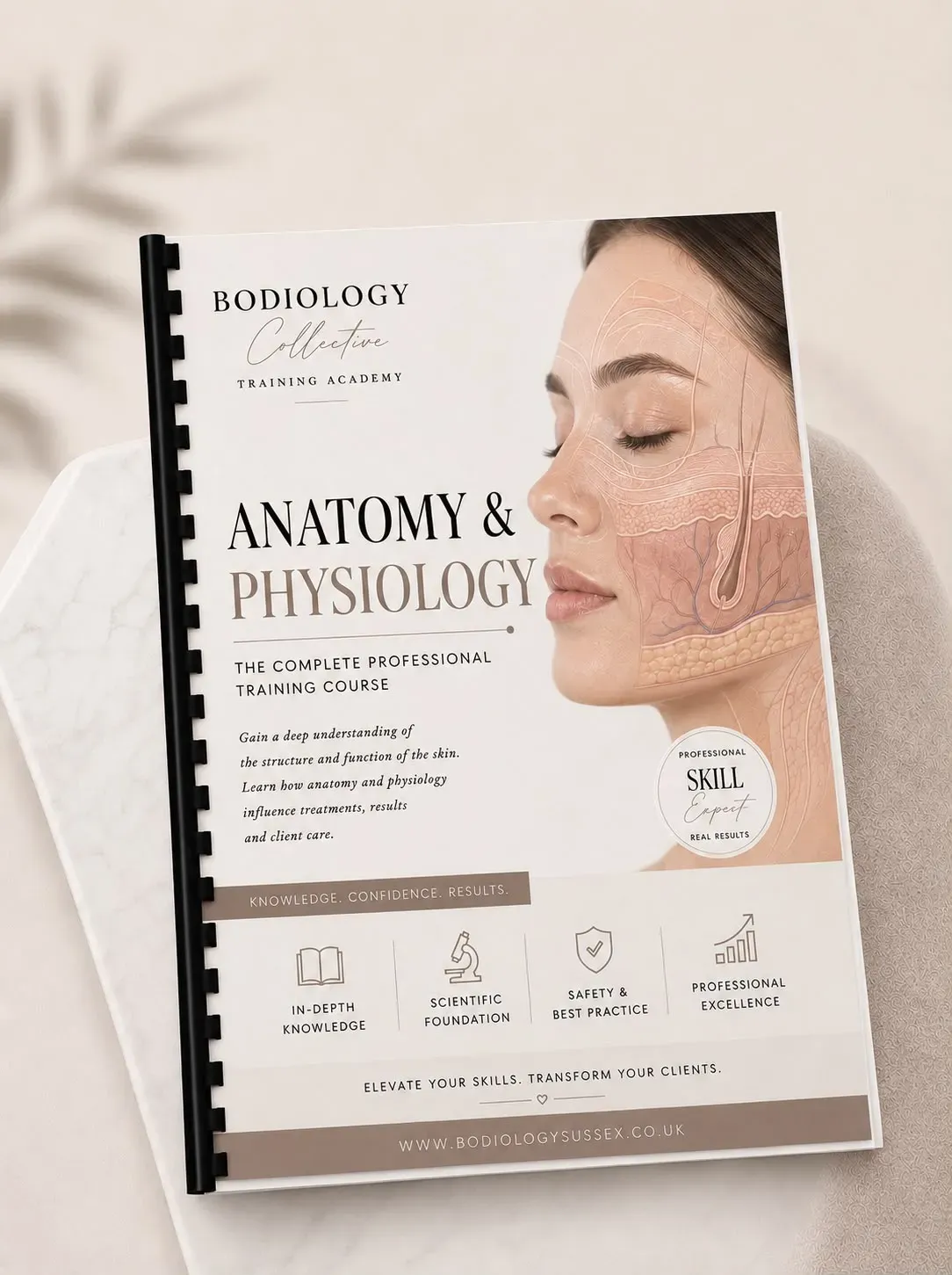 Anatomy and Physiology Booklet on beige background