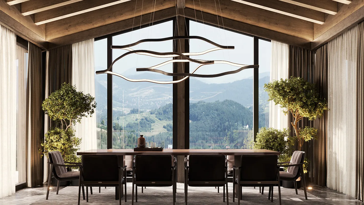 Peakside Chalets Cyprus double-height lounge with dramatic chandelier, stone feature wall, and indoor greenery