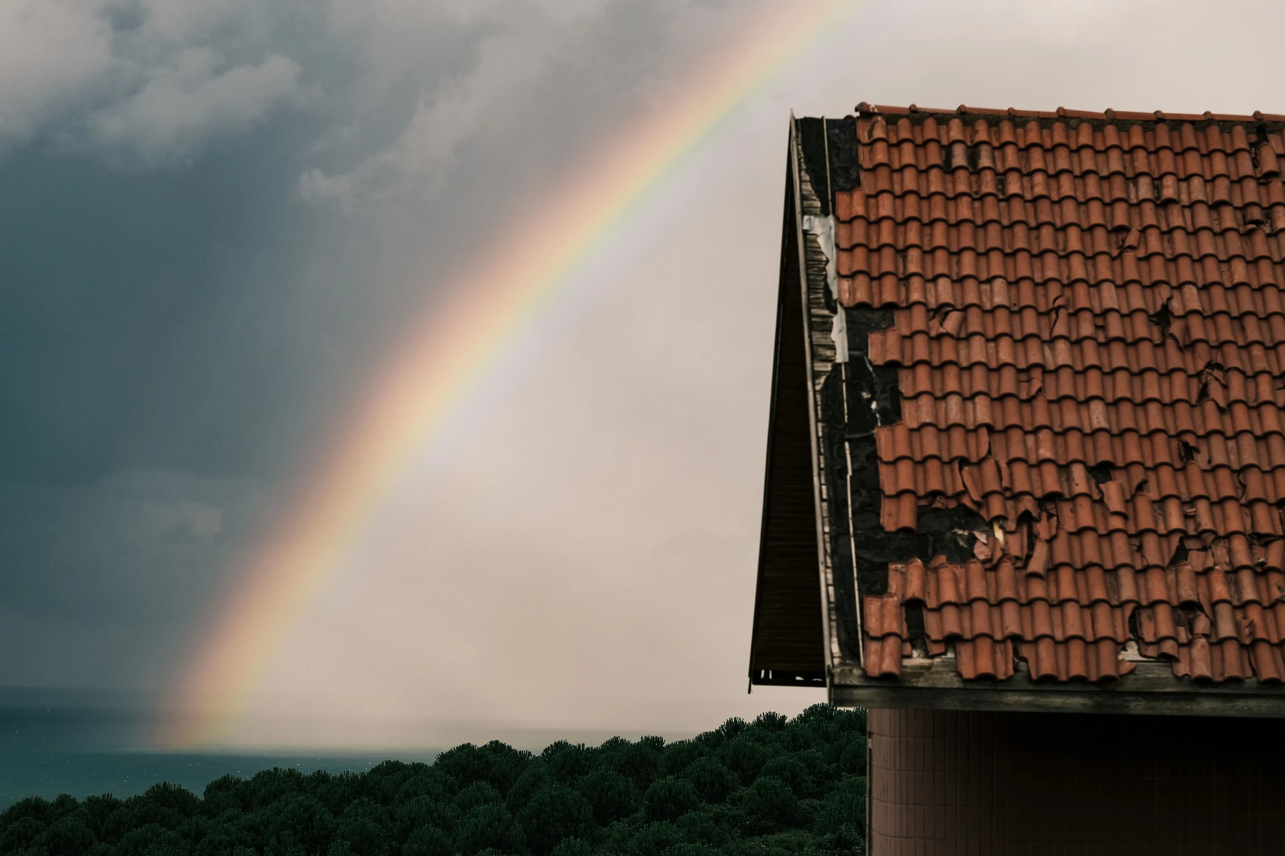 Roof beneath a cloudy sky