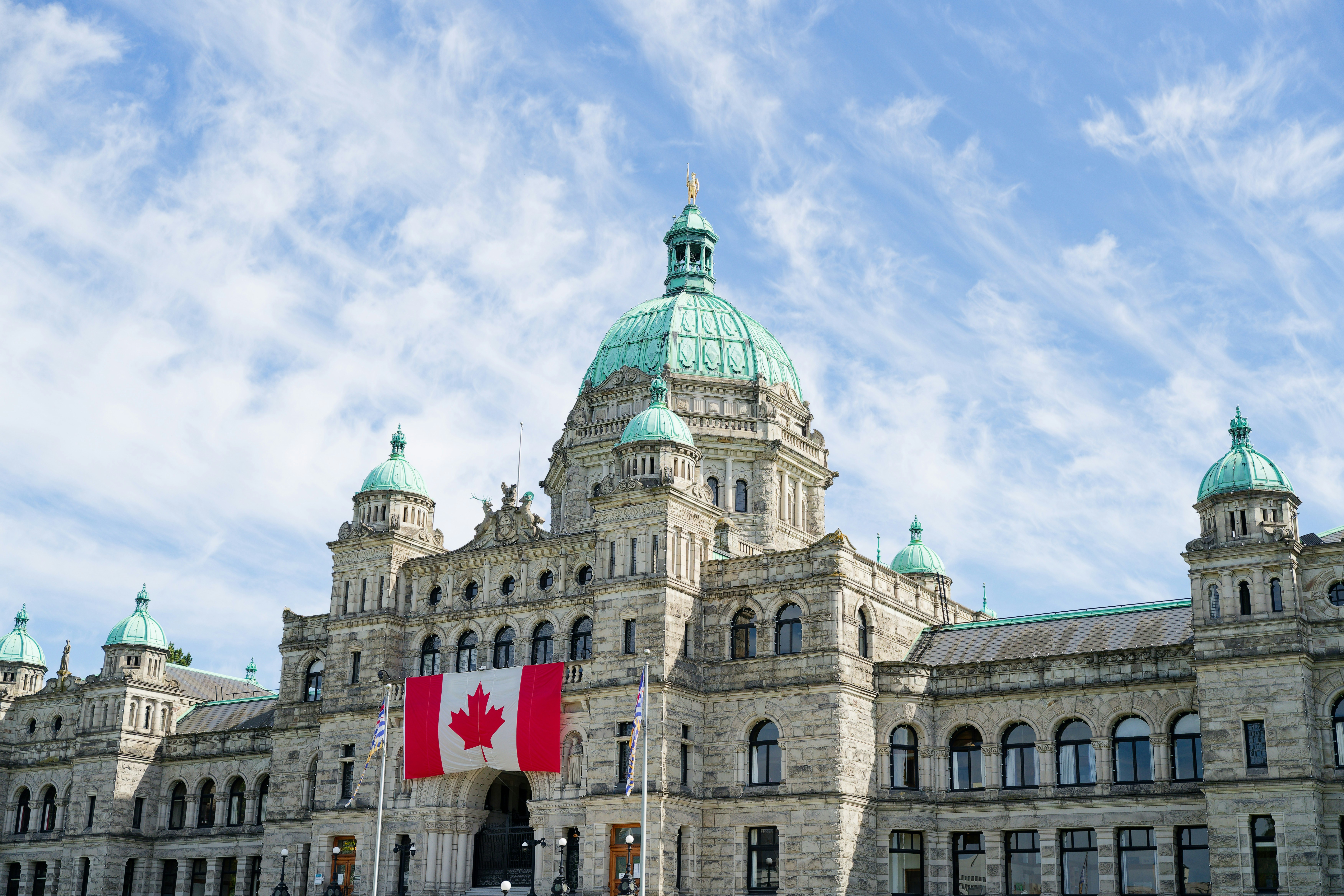 The british columbia parliament buildings display the canadian flag.