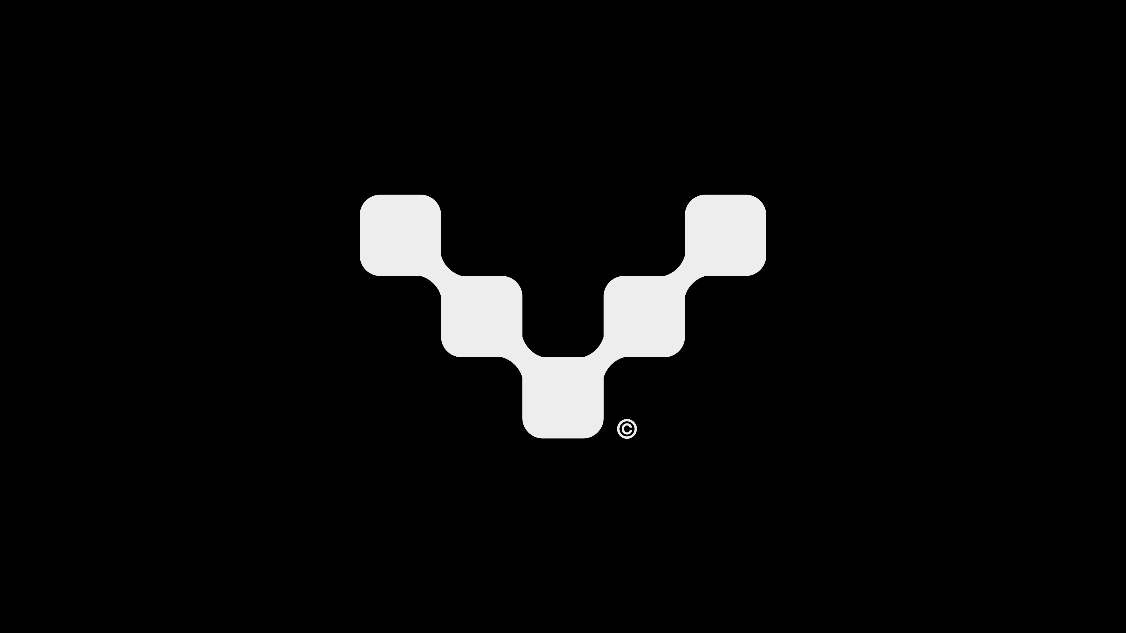 Modern home office setup with a monitor, ergonomic chair, keyboard, and indoor plants near a window with blinds.