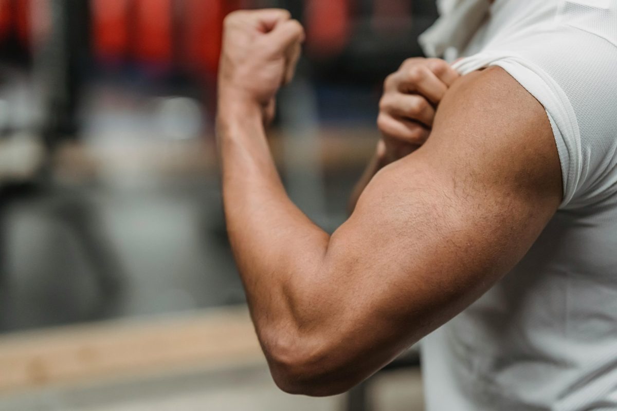 A man curls his bicep.