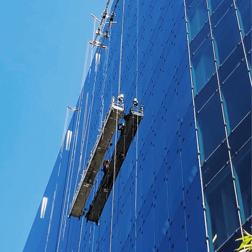 two people looking at a tablet and smiling