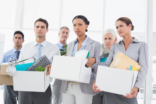 Professionals holding boxes filled with various items