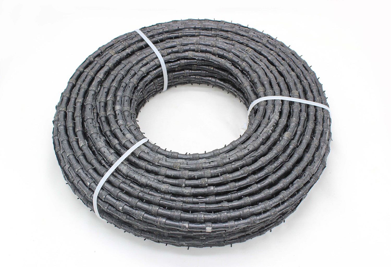 Full view of a coiled Diamond Wire Saw for marble cutting, suitable for wet cutting with high efficiency.