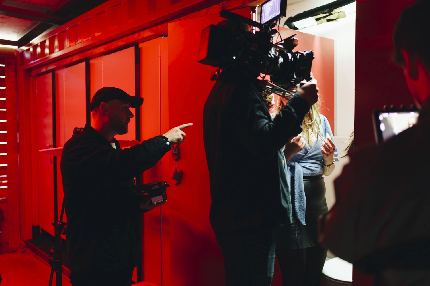 The image captures the ethereal beauty of an underwater cave illuminated by sunbeams penetrating through an opening above.