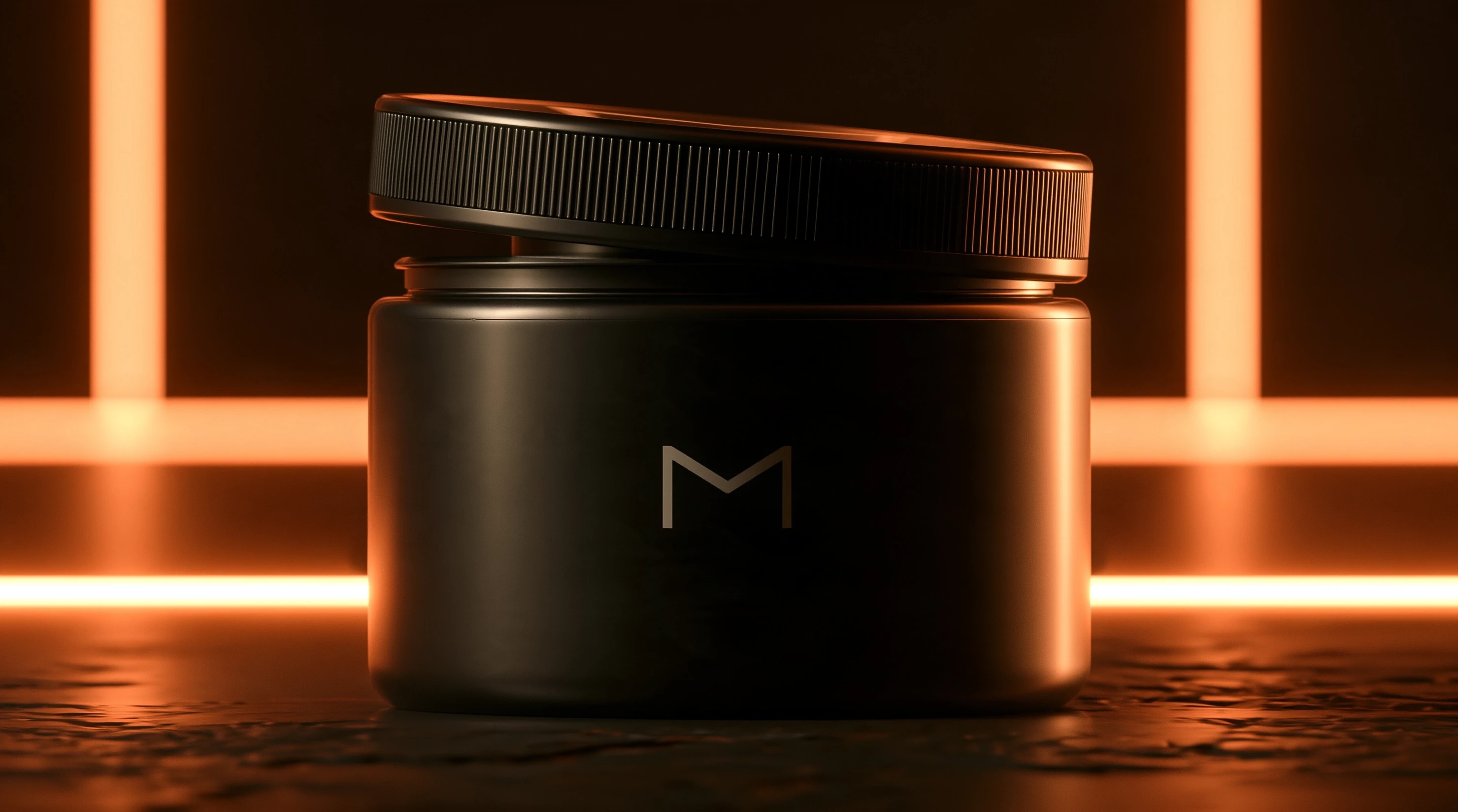 Dark jar with an M monogram and a tilted, partly open ribbed lid against orange strip lighting.