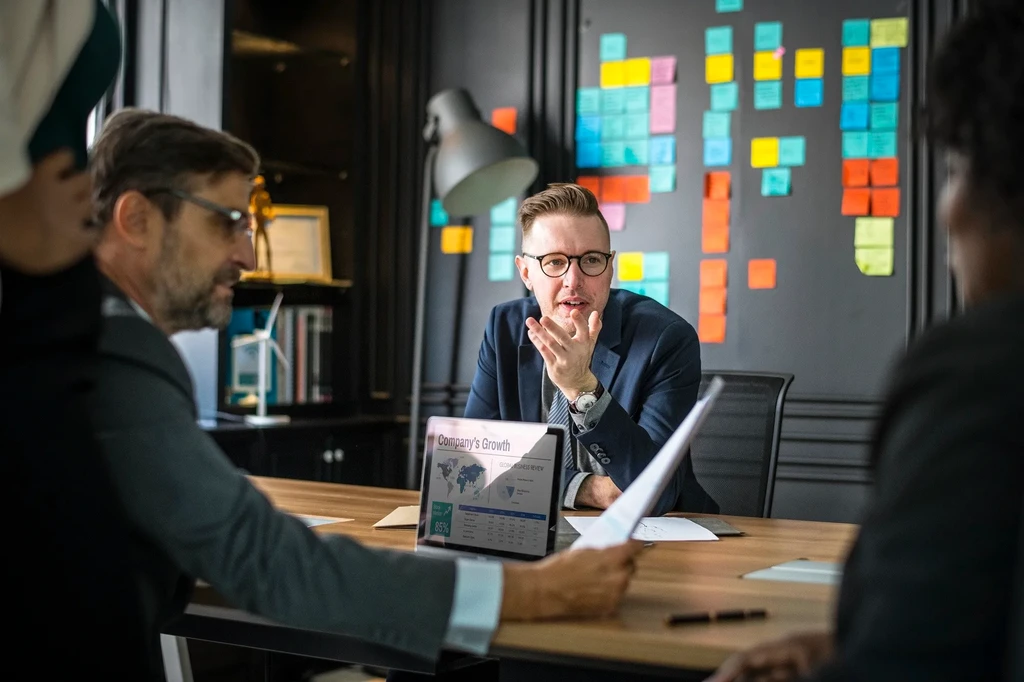 People having a meeting about website development and design project