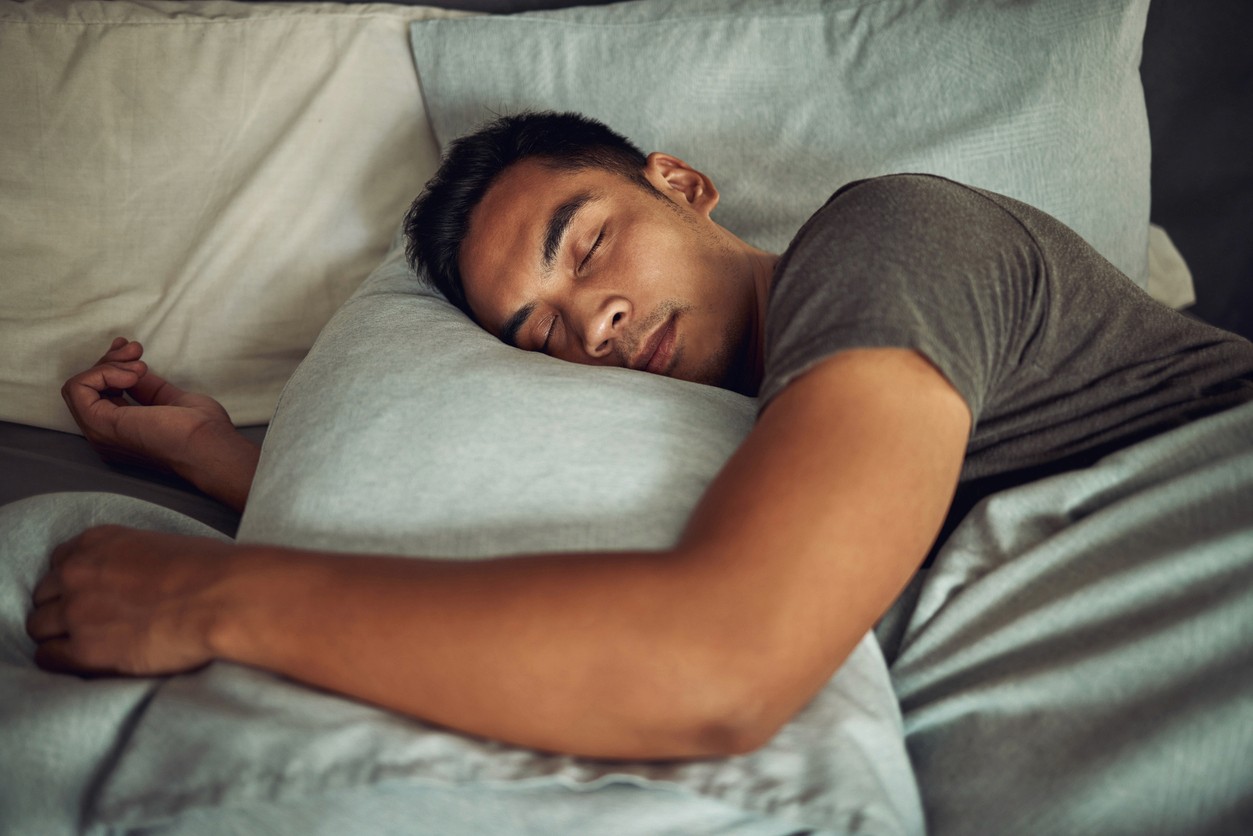 Man sleeping in summer in a t-shirt