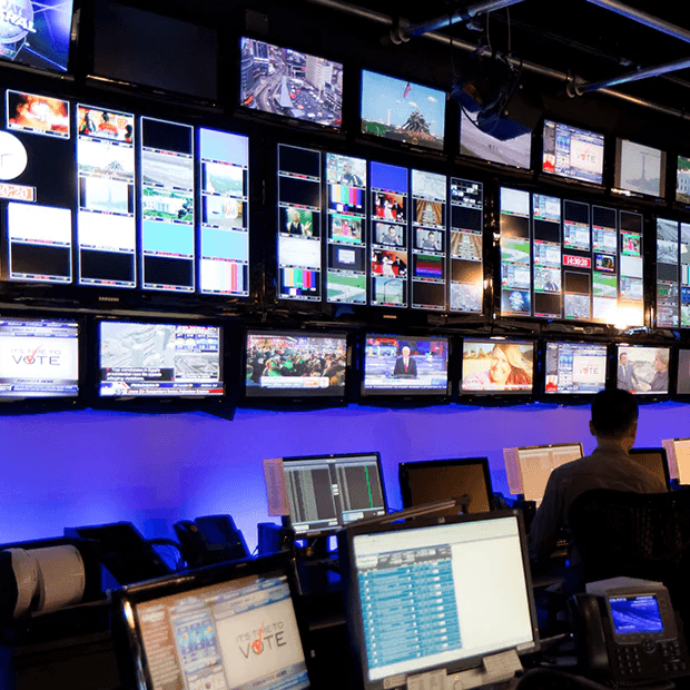 Broadcast studio control room monitors and workstations
