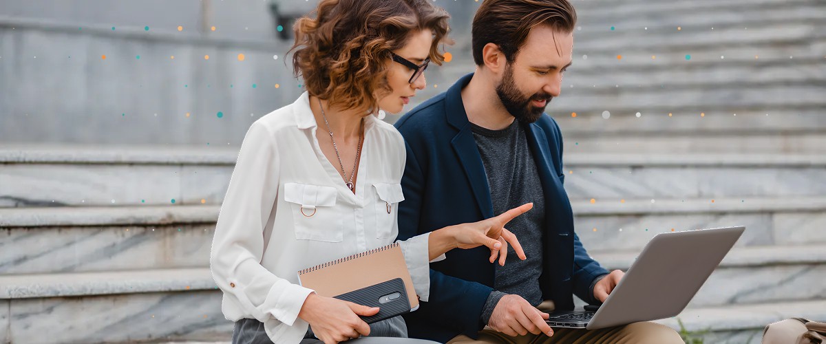 people looking at a laptop together