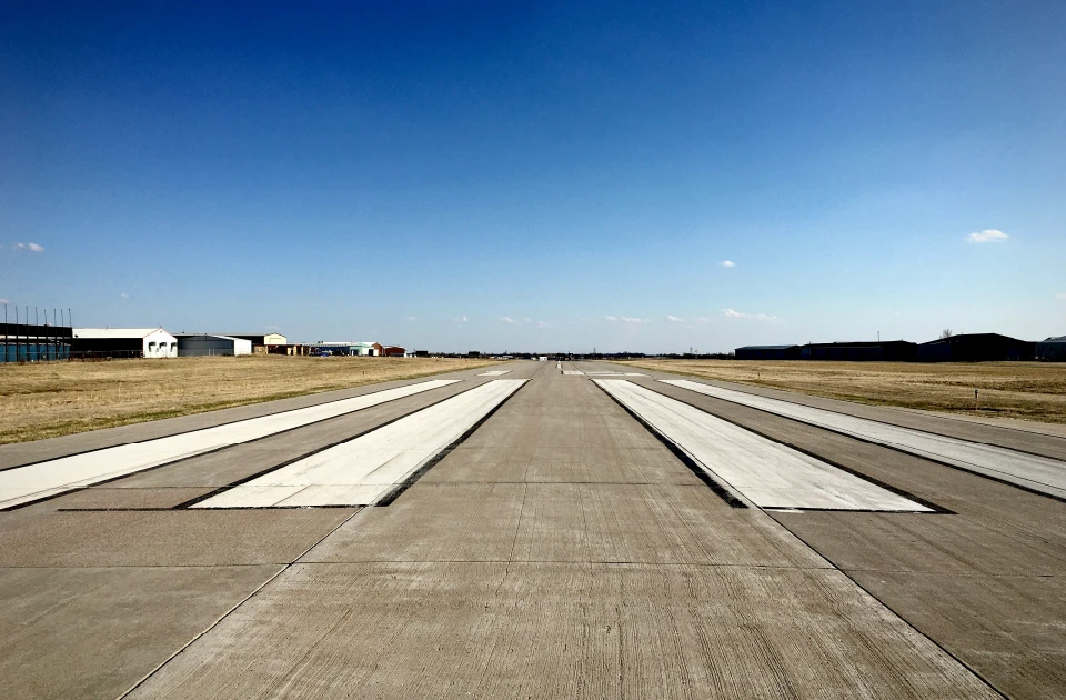 white and gray airplane on airport during daytime