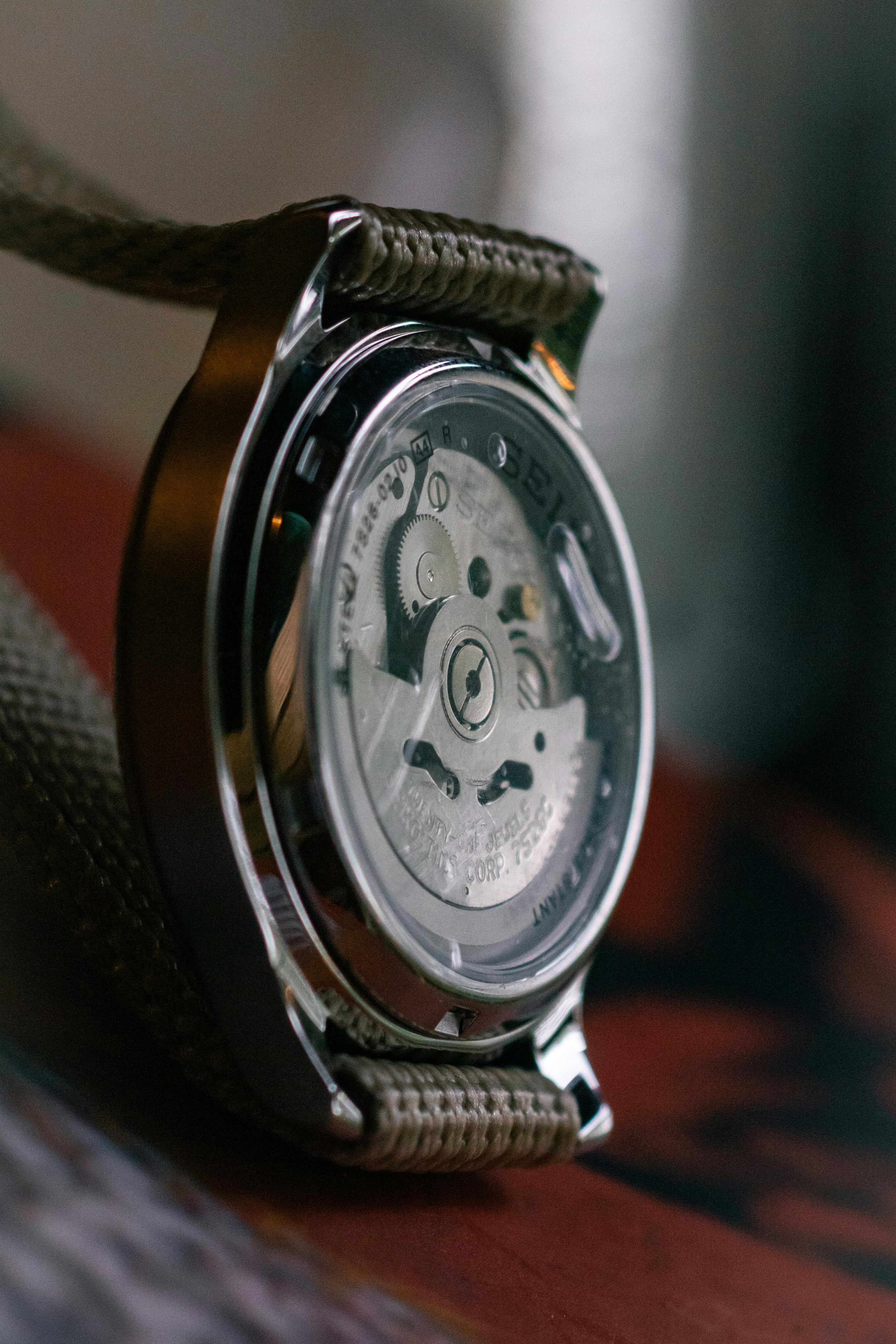 Seiko watch showing the see-through caseback exposing the automatic movement powering the watch