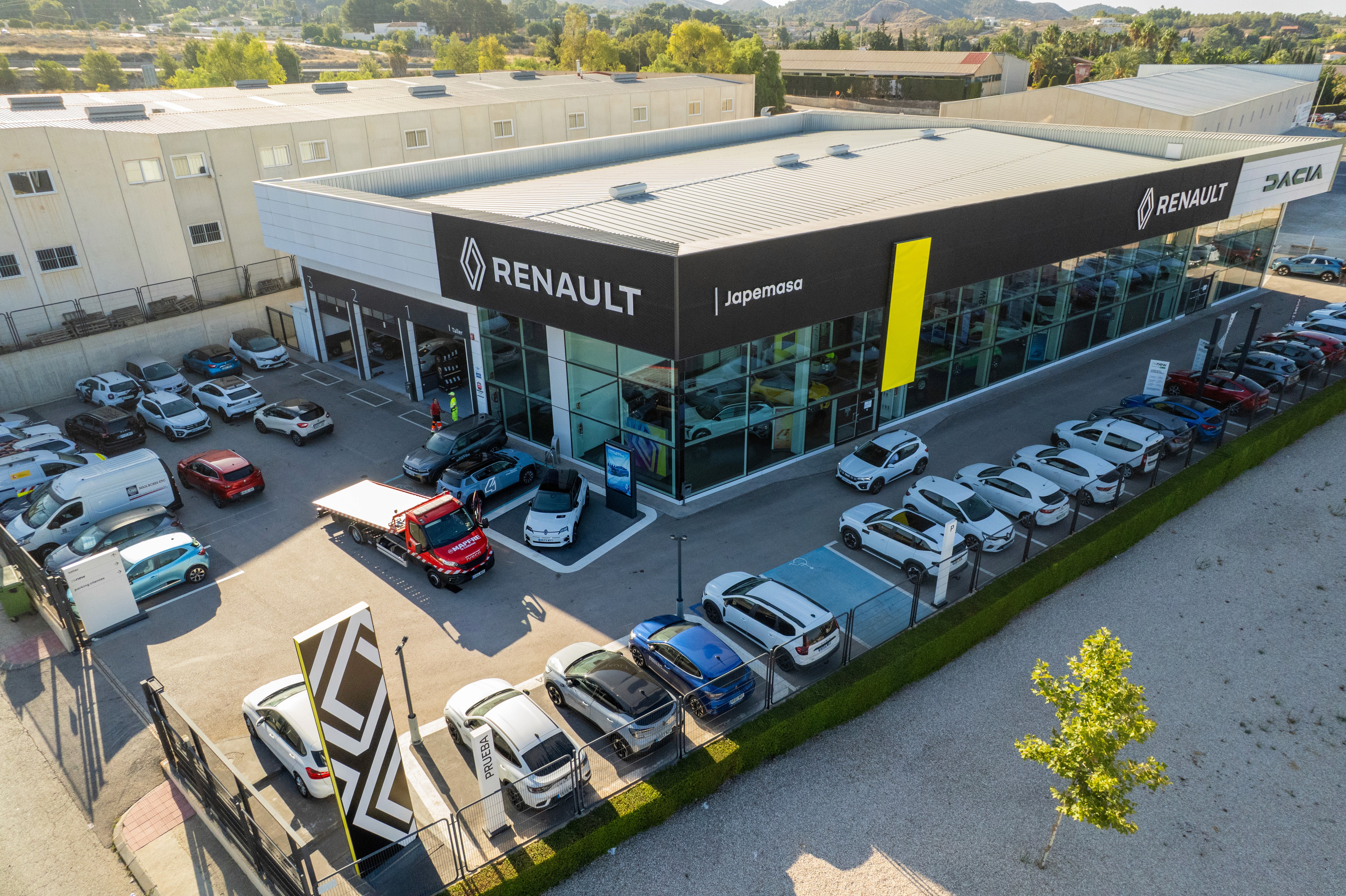 Two men wearing yellow and black face masks, standing side by side, with neutral expressions on their faces.