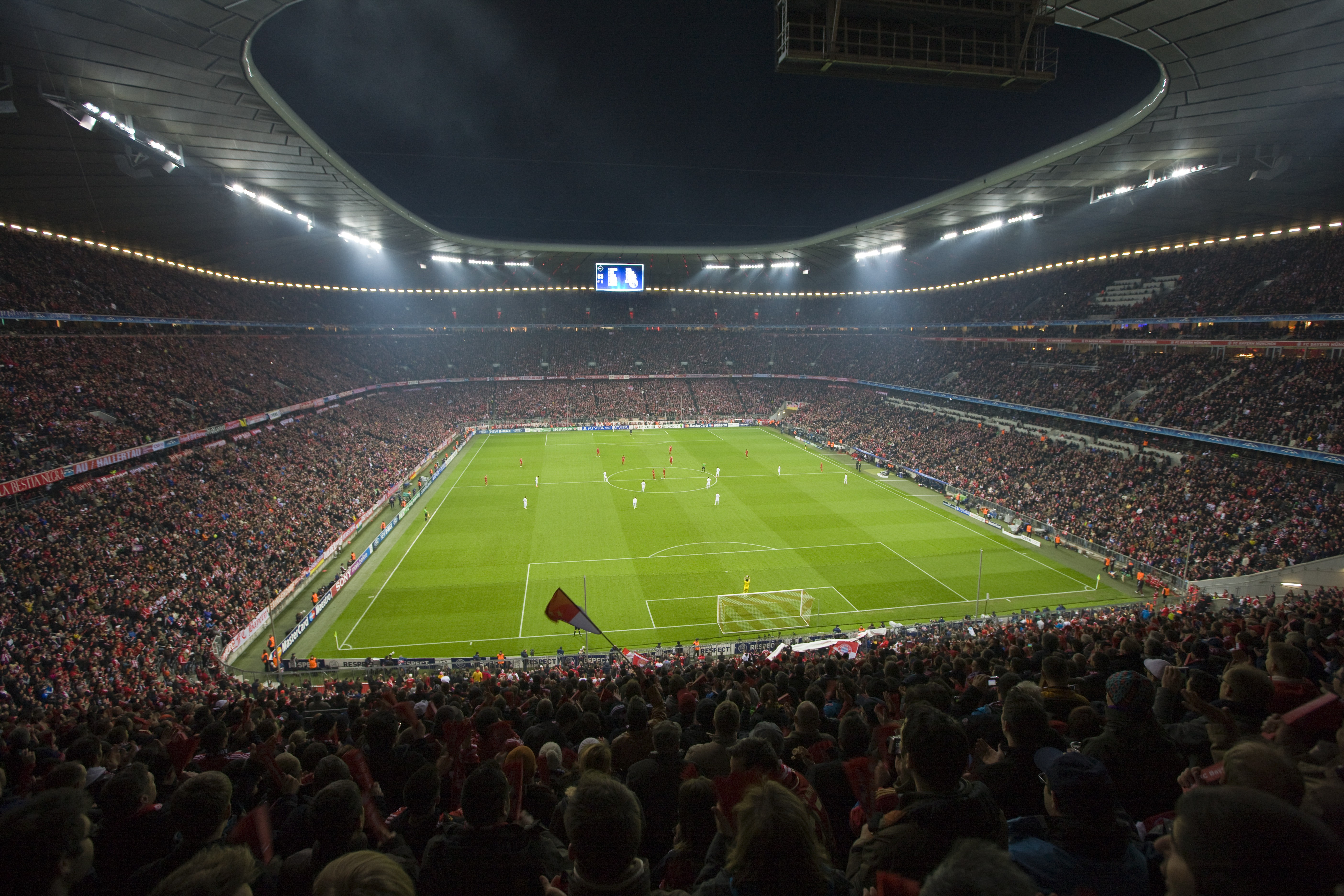 A wide angle shot of a soccer feild within a stadium