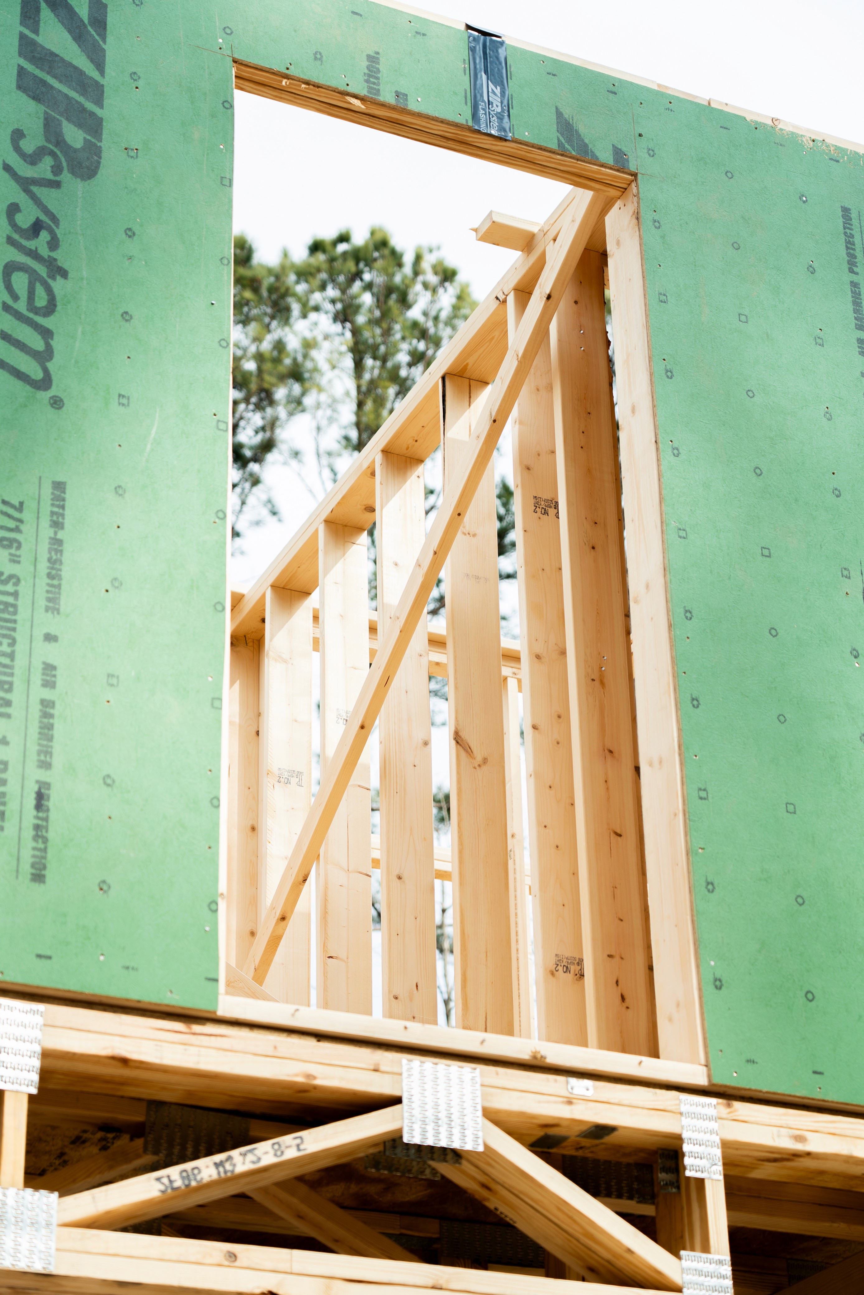 Close-up of gable framing detail with ZIP System structural sheathing on an SEGC build