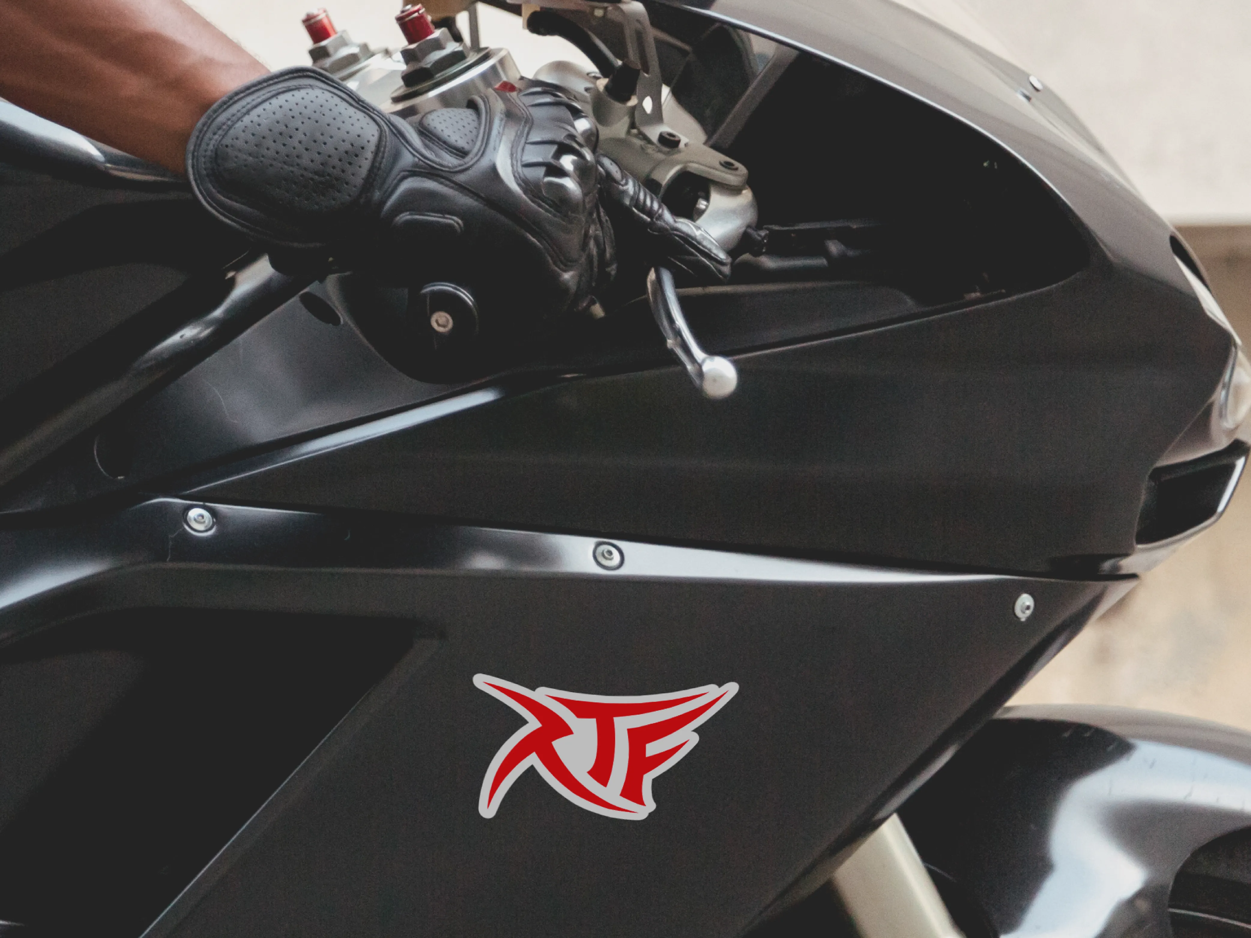 RTF black logo on a red clean background