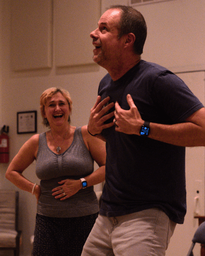 Two students having fun performing improv in a Black Sheep Comedy improv class in Carrboro and Chapel Hill