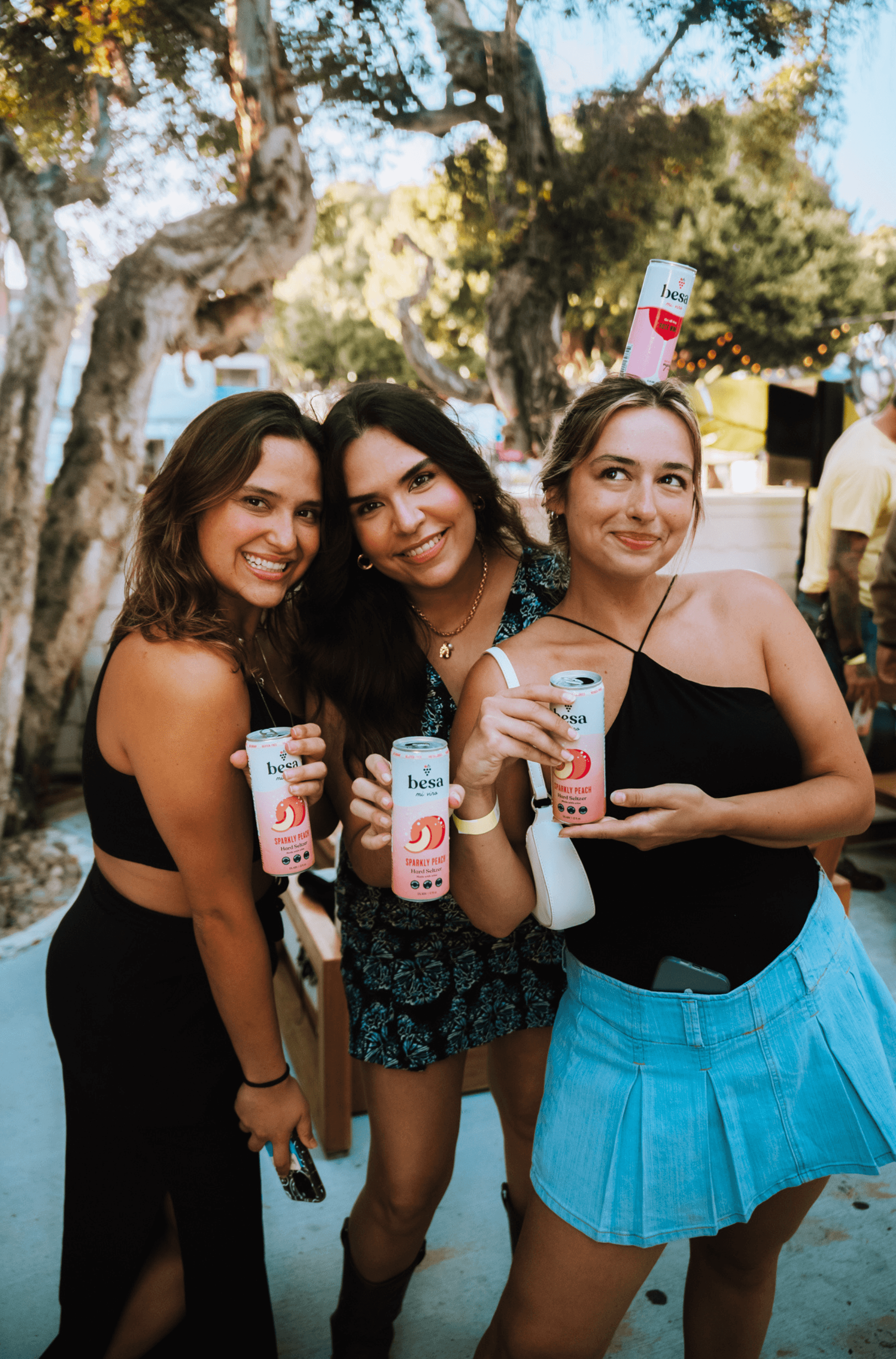 cans of hard seltzer and wine glass